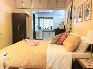 a bedroom with a large bed with pillows on it at Bandra Studio Lokhandwala House, Near Carter Road, Palli Hill by Connekt Homes in Mumbai