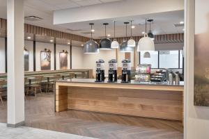 a coffee shop with a counter and tables at Fairfield Inn & Suites by Marriott Penticton in Penticton