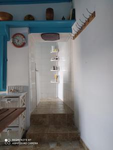a hallway in a house with a blue ceiling at Aiolos TRADITIONAL HOUSE IN ASTYPALAIA in Astypalaia