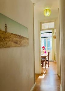 a dining room with a table and a window at Downtown Apartment in Horta
