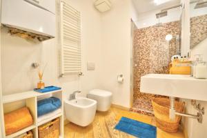 a bathroom with a sink and a toilet and a shower at Casa dell'Arco - 1 min walking from the beach in Santa Margherita Ligure +21 photos