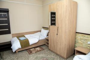 Ένα ή περισσότερα κρεβάτια σε δωμάτιο στο ASA Hotel