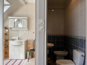 a bathroom with a toilet and a sink at Sielski wypoczynek blisko Kołobrzegu in Dębogard +32 photos