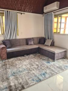 a couch sitting in a living room with a rug at Hurghada, mubark6 in Hurghada
