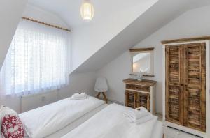 Ένα ή περισσότερα κρεβάτια σε δωμάτιο στο Maisonette Amalie