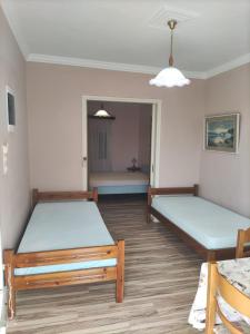 Postel nebo postele na pokoji v ubytování SISSY APARTMENT