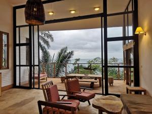 a living room with a view of a patio at Takina house in Santana