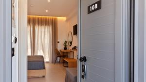 a door leading into a room with a bedroom at Brisot in Galatas