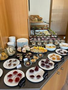 a buffet with many plates of food on a table at Pension Keller in Reichenau