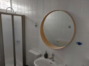 a bathroom with a sink and a mirror at Ferienwohnung in Worms in Worms