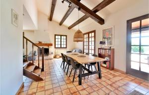 a kitchen and dining room with a table and chairs at Amazing Home In Saint-pierre-de-vassol With Outdoor Swimming Pool in Saint-Pierre-de-Vassols