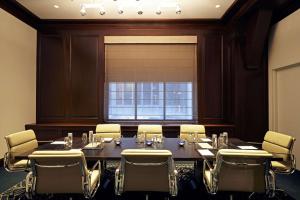 a conference room with a large table and chairs at Hyatt Centric The Loop Chicago in Chicago