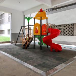 a childrens playground with a slide and a slideintend at Heartland Gardens Apartments Kilimani Nairobi in Nairobi