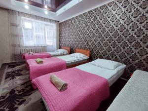 Postel nebo postele na pokoji v ubytování Guest House Adimi