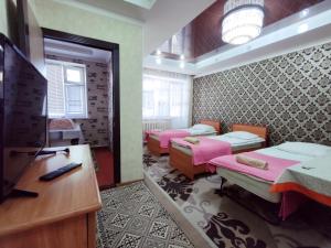 TV a/nebo společenská místnost v ubytování Guest House Adimi