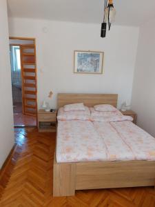 Posteľ alebo postele v izbe v ubytovaní Krisztina apartman