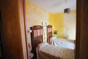 Postel nebo postele na pokoji v ubytování B & B L'almanacco