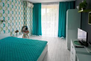 Postel nebo postele na pokoji v ubytování Hotel Sea Star Приморско + 37 fotografií