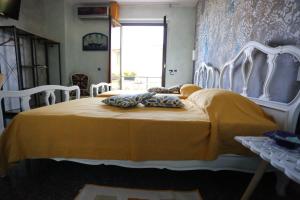 Postel nebo postele na pokoji v ubytování B & B L'almanacco