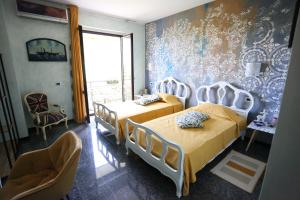 Postel nebo postele na pokoji v ubytování B & B L'almanacco