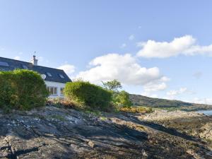 a house on the shore of a rocky beach at The House On The Slip - Uk43806 in Kylerhea