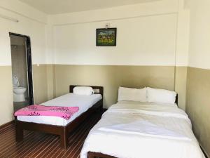 Postel nebo postele na pokoji v ubytování Hotel Peace Valley