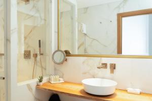 a bathroom with a white sink and a mirror at Boutique Hôtel Villa Fabulite in Antibes +37 photos