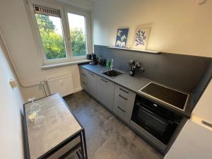 Nhà bếp/bếp nhỏ tại Modernes Apartment/Nähe Zentrum