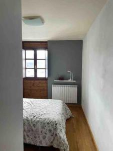Postel nebo postele na pokoji v ubytování Apartamento en residencial formigal