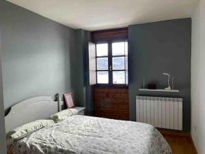 Postel nebo postele na pokoji v ubytování Apartamento en residencial formigal