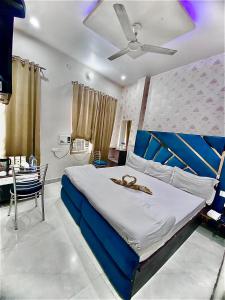 Voodi või voodid majutusasutuse Swaran hotel toas