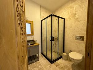 a bathroom with a shower and a toilet in it at Alaçatı Aura Plus in Izmir