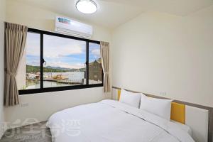 Postel nebo postele na pokoji v ubytování Happy Dragon Homestay
