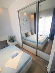 Postel nebo postele na pokoji v ubytování Rita Apartments - Sea-view apartment 2plus1