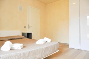 Posteľ alebo postele v izbe v ubytovaní Lazise Boutique Apartment Lago e Relax