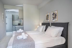 Posteľ alebo postele v izbe v ubytovaní Mary's Studios & Apartment