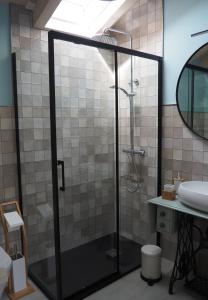 a bathroom with a shower and a sink at Casa gueli in Cangas de Onís