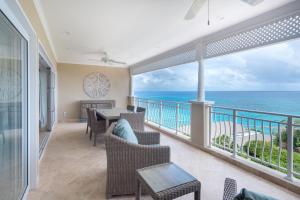 a dining room with a view of the ocean at The Crane Resort in Saint Philip