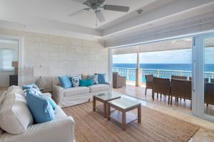 a living room with a view of the ocean at The Crane Resort in Saint Philip