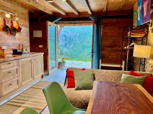 a living room with a couch and a table at La Cabaña María in San Roque de Ríomiera
