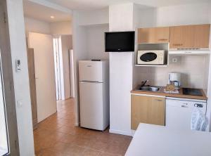 Kuchyňa alebo kuchynka v ubytovaní Résidence Graziella Appartement 627 + 10 fotografií