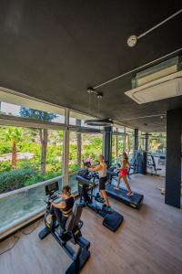 a group of people running on treadmills in a gym at Kairos Valley Health & Nature Resort in Datca