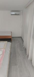 Postel nebo postele na pokoji v ubytování Fontana Apartman