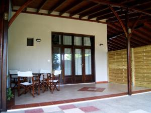 a patio with a table and chairs in a house at Zafira Retreat in Vatopedi