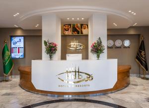 a lobby of a hotel with a reception counter at HDB Al Sahafa in Riyadh +73 photos