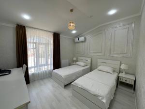 Postel nebo postele na pokoji v ubytování Ideal Hotel