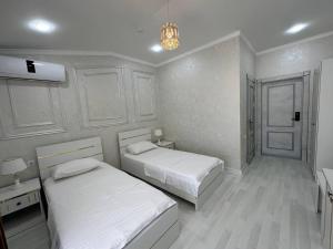Postel nebo postele na pokoji v ubytování Ideal Hotel