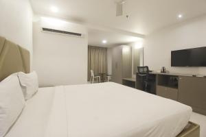 Postel nebo postele na pokoji v ubytování Hotel SSR GRAND