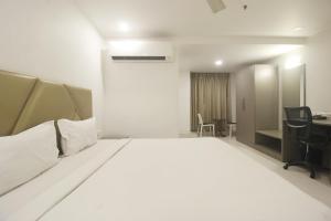 Postel nebo postele na pokoji v ubytování Hotel SSR GRAND