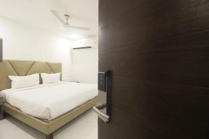 Postel nebo postele na pokoji v ubytování Hotel SSR GRAND